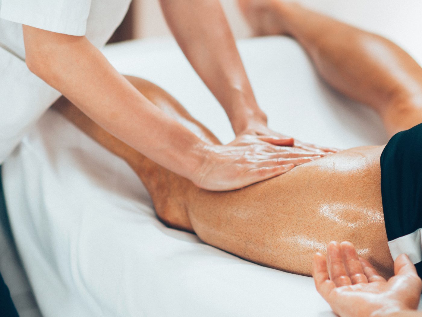 Massage Therapy in Waterloo: a registered massage therapist treating a patient’s leg
