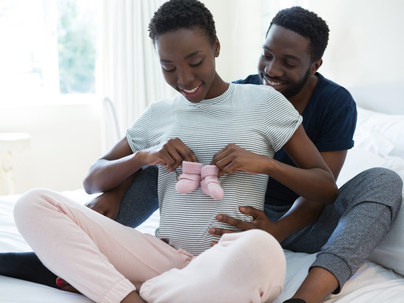 Waterloo Chiropractic Care During Pregnancy: expecting parents holding a pair of baby socks